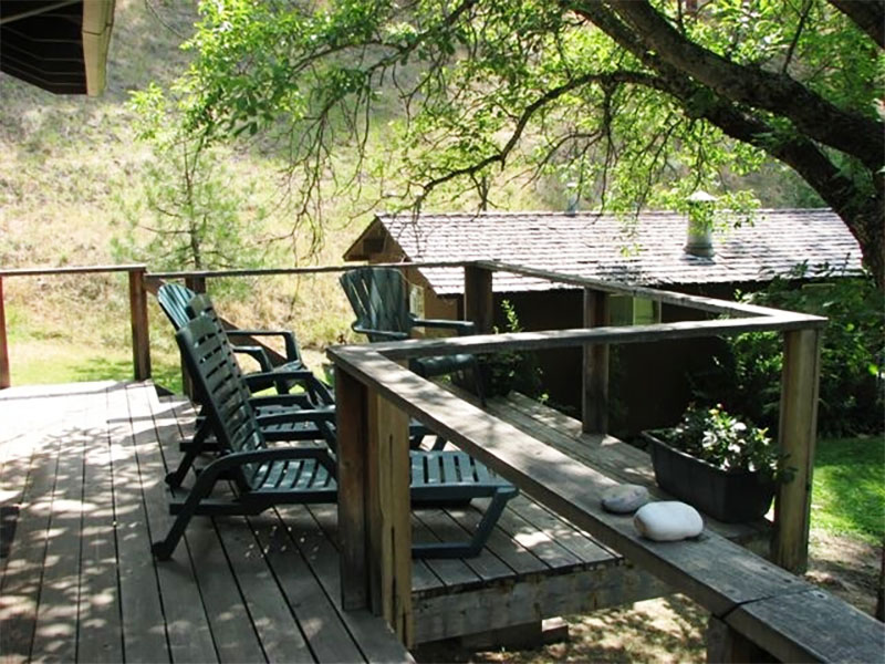 Cool shade on the deck of Filer Cabin.